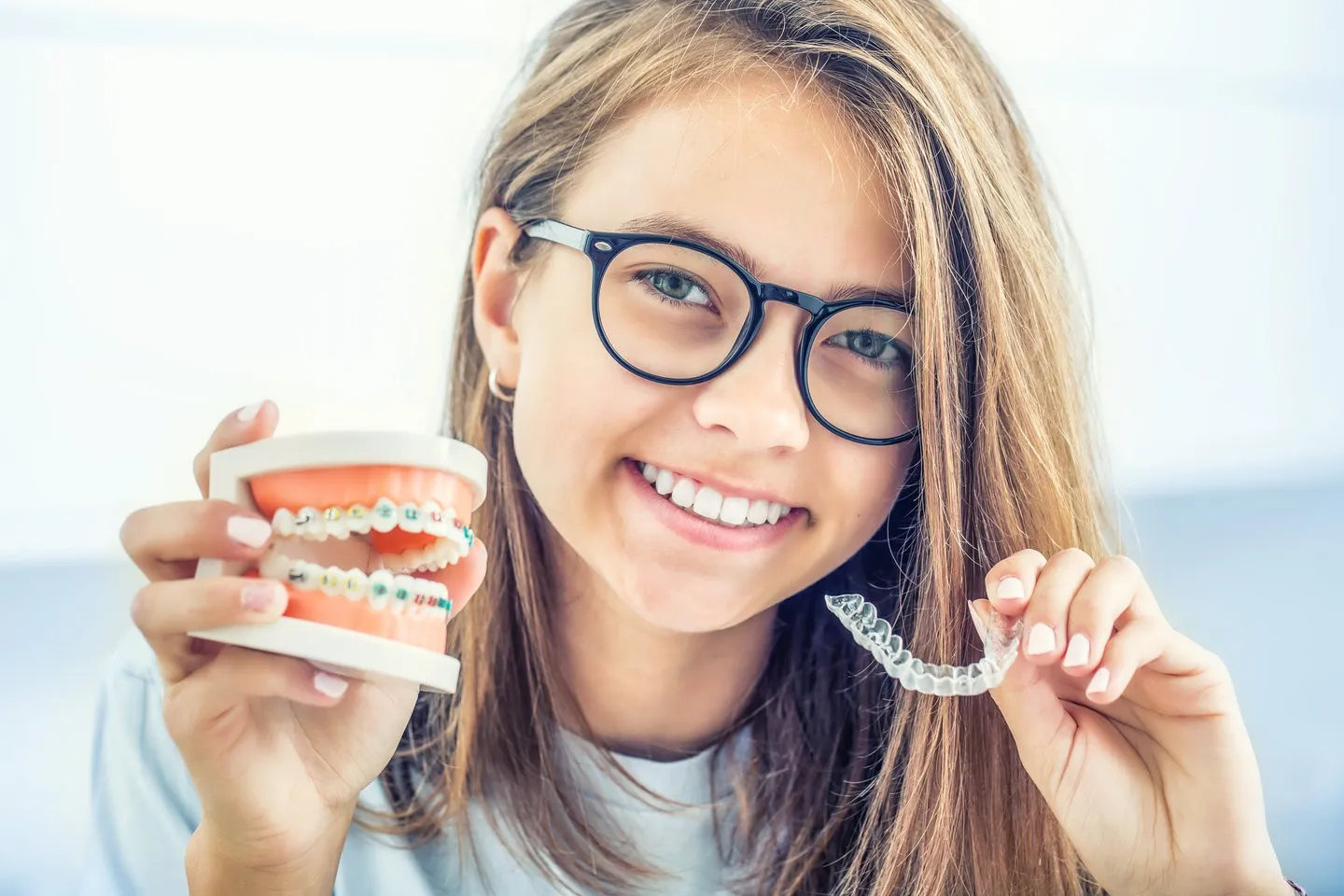 Invisalign clear aligner trays on a table - Heart of Hingham Dental Aesthetics Hingham MA